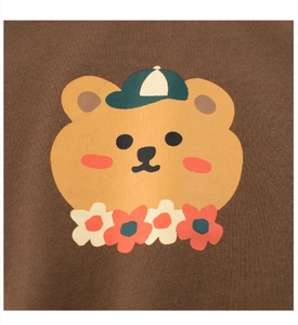 Detailed view of kids cotton t-shirt with cute cartoon bear print and knit fabric texture