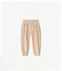 Detail of floral print children's mosquito pants with elastic waist and jogger cuffs