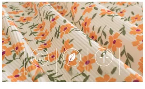 Close-up of soft ribbed fabric with orange floral print for kids mosquito pants
