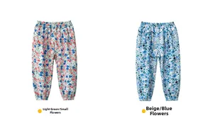 Detail view of floral print mosquito pants for kids in light green and apricot colors
