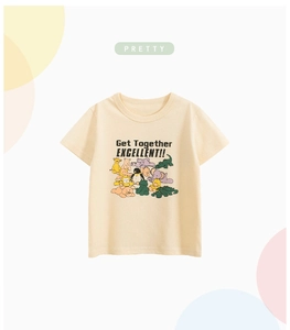 Close-up of beige cotton kids T-shirt featuring colorful cartoon animals and printed text