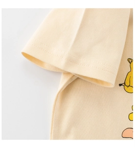 Close-up of cream cotton t-shirt fabric with knit texture and double-stitch seam detail