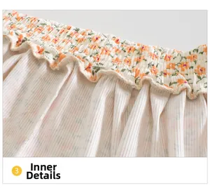 Detailed macro view of the elastic waistband and floral print on breathable baby pants