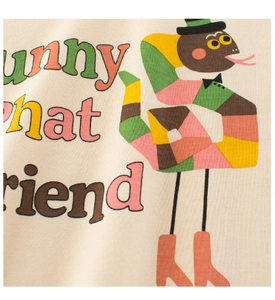 Close-up of kids cartoon snake print on cotton T-shirt with sunny and friend text detail