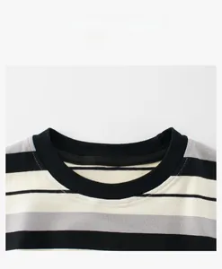 Close-up of black ribbed crew neck on a black and white striped cotton knit T-shirt