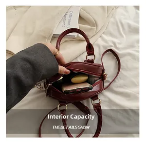 Internal view of dark red bowling bag showing space for phone and essentials