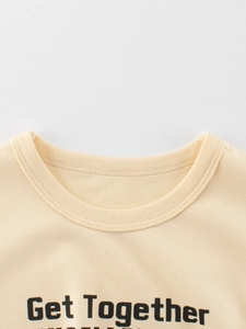 Close-up of cream-colored kids t-shirt with Get Together print and reinforced crew neck