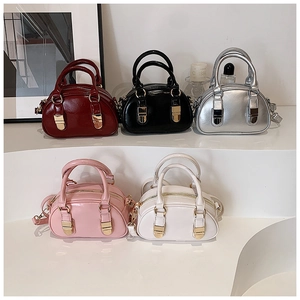 Mini bowling handbags shown in wine red, black, silver, pink and white glossy leather