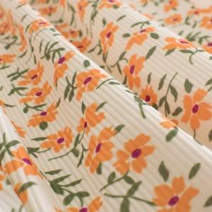Kids breathable mosquito pants in beige ribbed fabric with vibrant orange floral print