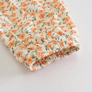 Close-up of baby floral ribbed mosquito pants with elastic cuffs in soft cotton
