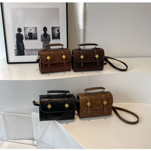 Classic vintage square crossbody bags in four colors displayed on a modern white stand