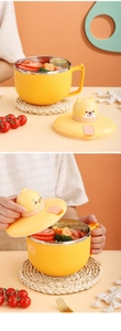 Detail of yellow stainless steel noodle bowl featuring a cute Shiba Inu mechanical timer lid