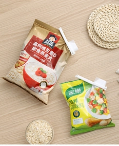 Detail of white plastic sealing clip with pour spout on a cereal bag for food freshness