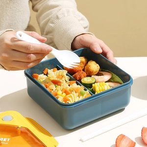 Japanese style blue and yellow divided bento lunch box with lid and reusable utensils