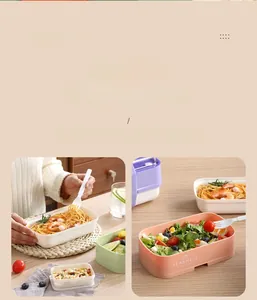 Detailed view of pink and green stackable food-grade plastic lunch boxes for meal prep