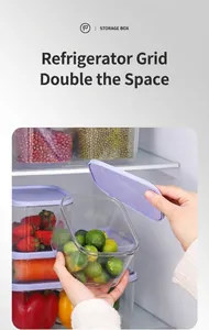 Close-up of stackable PET food storage boxes with purple lids inside a refrigerator