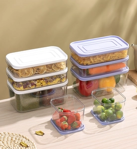Detailed view of clear PET food storage containers with pasta and fresh vegetables