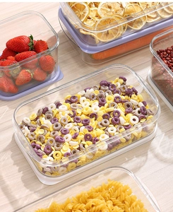 Detailed view of clear PET food storage containers holding grains and fresh strawberries