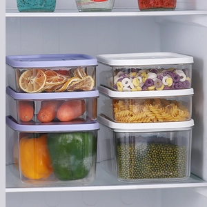 A set of PET food storage containers with airtight lids in a refrigerator organization scene