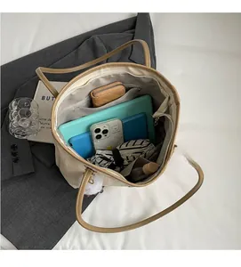 Top-down view of spacious tote bag interior with multiple compartments and zipper pocket