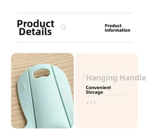 Detail of light green foldable cutting board featuring a hanging handle for storage