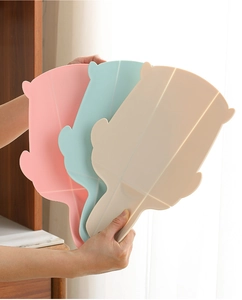 Foldable plastic cutting board set in pink, blue, and beige colors for outdoor travel