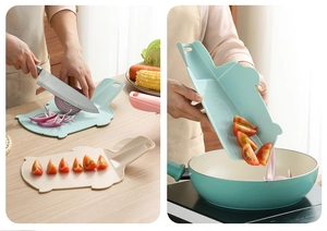 Flexible foldable cutting board showing chopped vegetables being poured into a pan