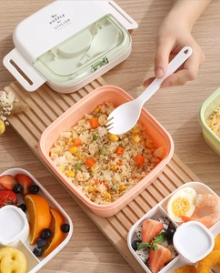 Detail view of double-layer bento box with built-in cutlery and stylish puzzle lid