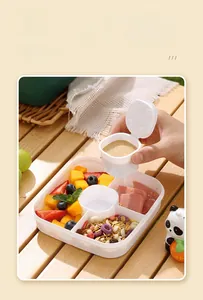 Double layered lunch box with separate sauce container and divided fruit compartments