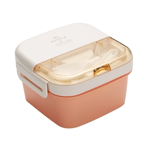 Double-layer bento box with utensil compartment and fork spoon set in orange and white