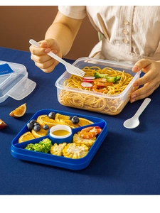 Detail of 1100ml blue bento box with divided tray for meal prep and salad storage