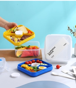 Detail of 1100ml lunch box with yellow and blue dividers plus fork and spoon set