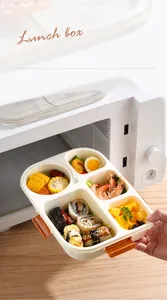 Detail of four-compartment microwave-safe lunch box with sushi and fresh fruit selection