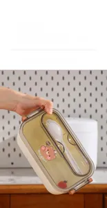 Detail of bear lunch box showing secure side buckles and leakproof silicone sealing ring