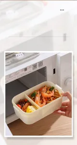Microwave-safe white bear lunch box with divided sections and food inside