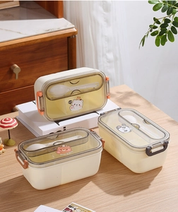 Three divided plastic lunch boxes with bear and panda cartoon lids and matching spoons