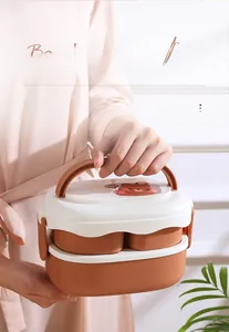 Close-up of double-layer lunch box featuring a folding handle and cute bear patterns