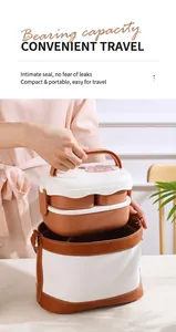 Double-layer bear lunch box being placed into a matching brown insulated carry bag