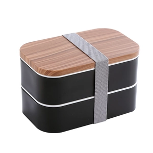 Double-layer bento box with wood grain lid and black matte body with elastic strap