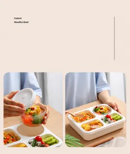 Detail view of a 4-compartment white lunch box with food and a clear sealing lid