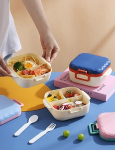 Three-compartment bento box with diamond texture lid and matching fork and spoon