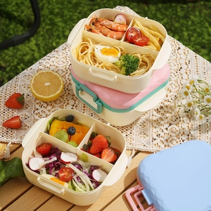 Three-layer stackable bento lunch box with compartments and geometric lid for picnics