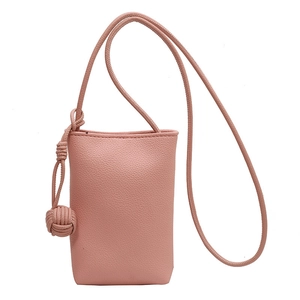 Pink minimalist crossbody phone bag with litchi texture and woven ball charm