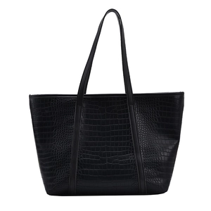 Detail of the high-quality black faux leather tote with textured crocodile embossing