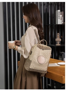 Retro beige backpack with dark monogram pattern and golden zipper details shown in a lifestyle scene