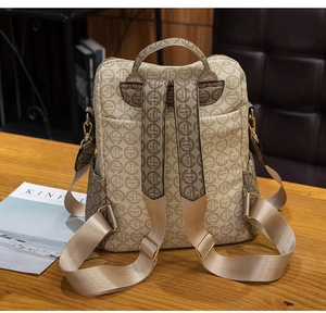 Detail of vintage monogram backpack showing adjustable nylon straps and side pocket