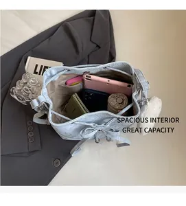 Spacious interior of light blue bucket bag showing large capacity for essentials