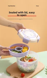 Macro detail of multi-layer lunch box with sauce tray and purple leak-proof lid