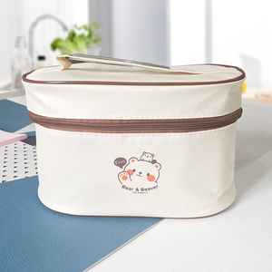 Portable thermal lunch bag in beige with cartoon bear print and top carry handle