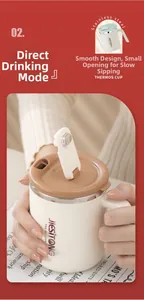 Macro detail of the cream stainless steel mug featuring the direct drinking lid and handle
